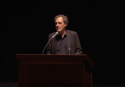 Author speaking at a book event.