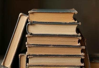 Stack of diverse used books.